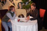przy stoliku z Georgiem Clooneyem w Muzeum Figur Woskowych - Madame Tussauds, Amsterdam, Holandia