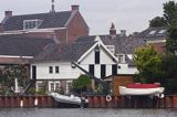 domy nad kanałem, okolice Goudy, Holandia